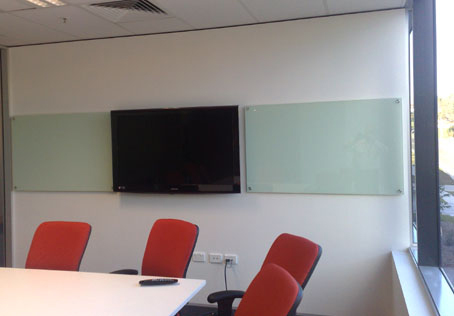 Photo of toughened glass boards either side of a TV